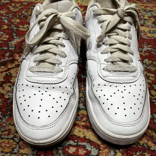 Deep crease across a leather upper before