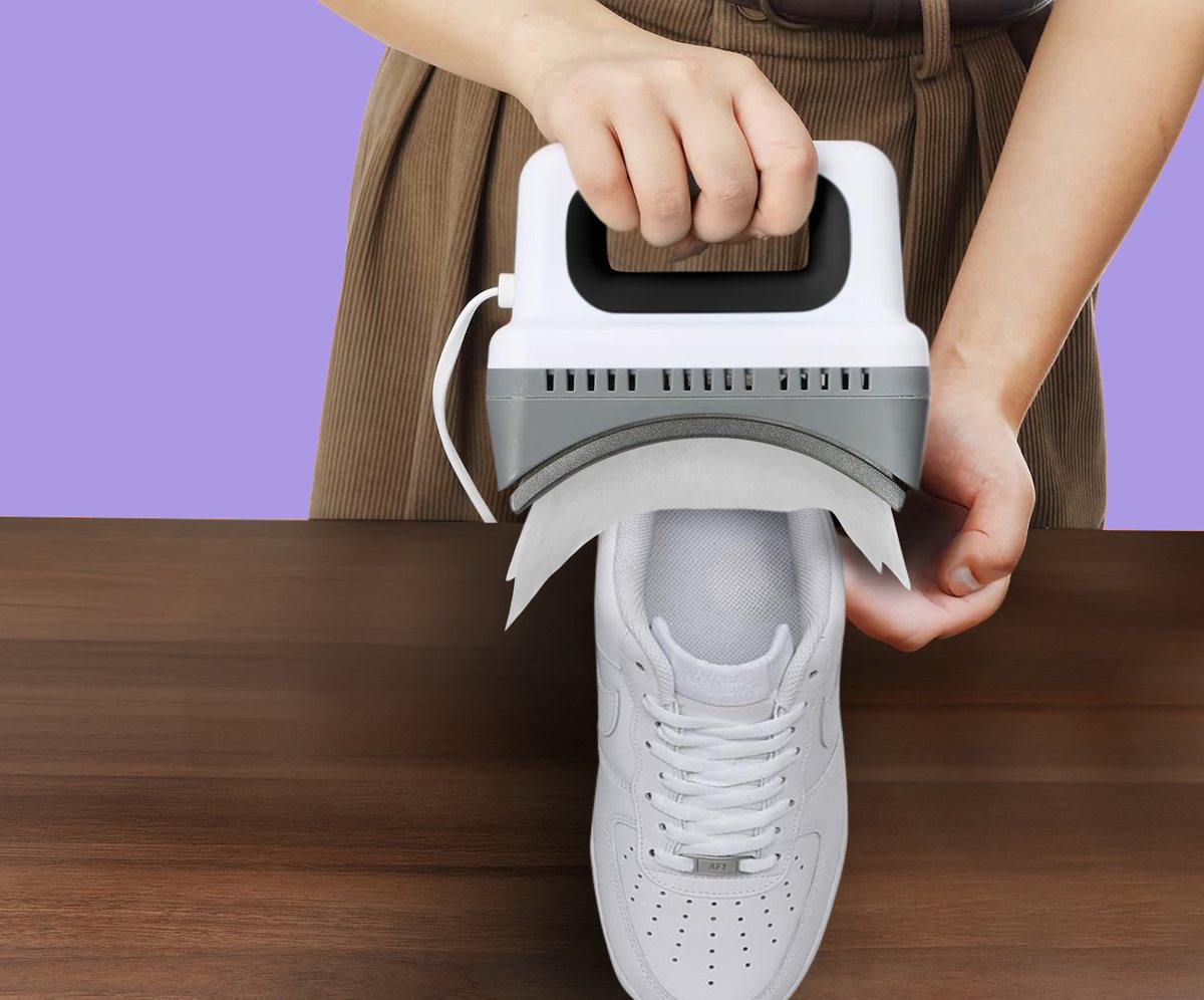 Shoe Decreaser pressing the toe box of a white Air Force 1
